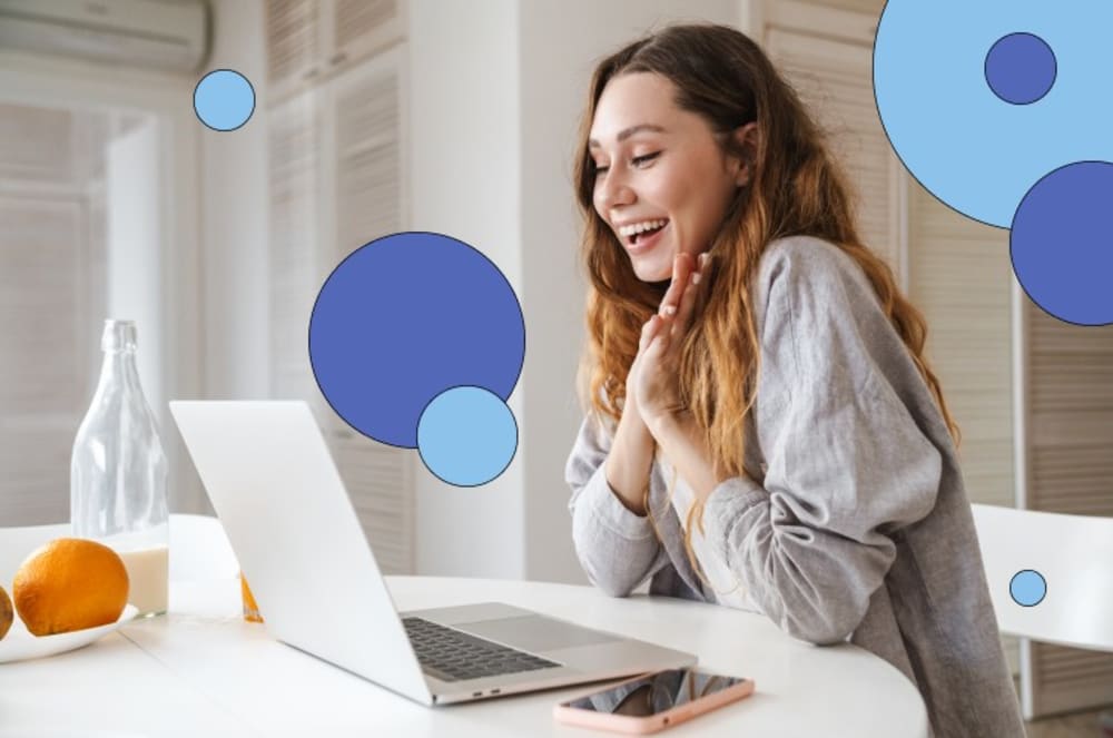 Woman smiling at laptop 