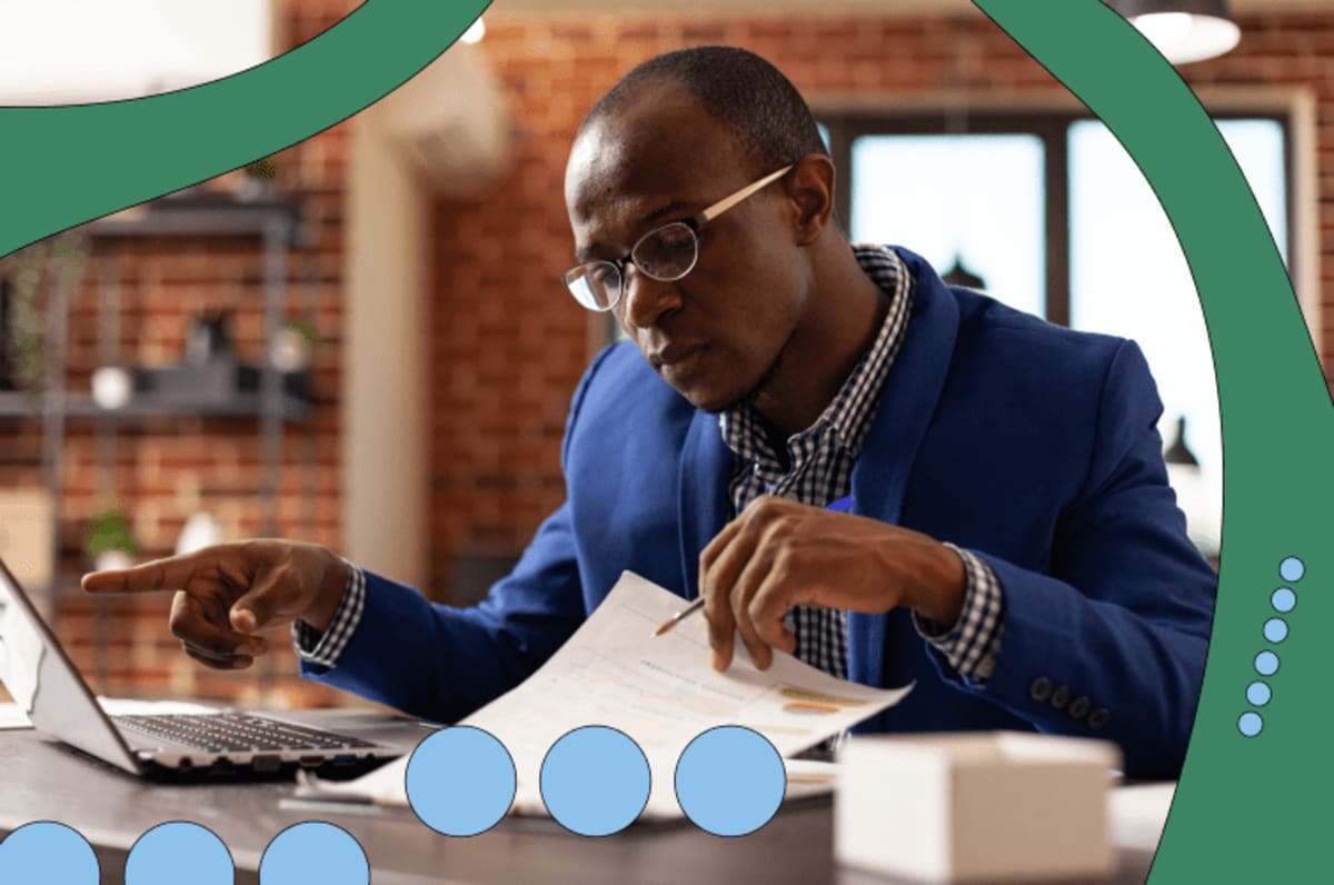 Man sitting at a desk, focused on his work