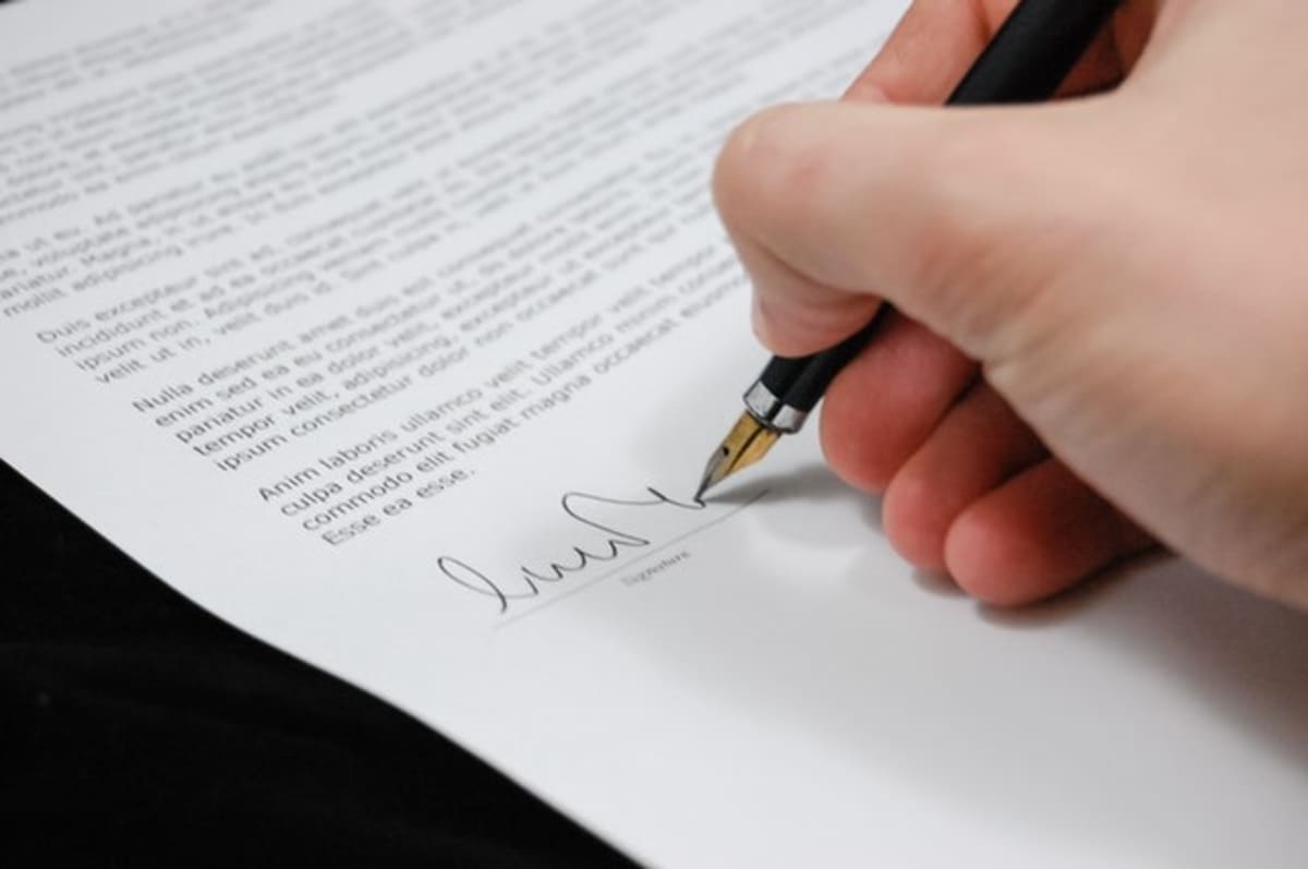 Person signing an employment contract