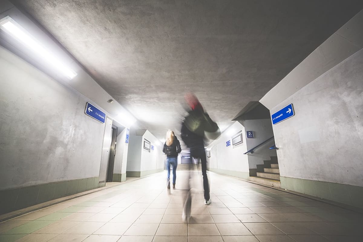 Woman walking in a subway station