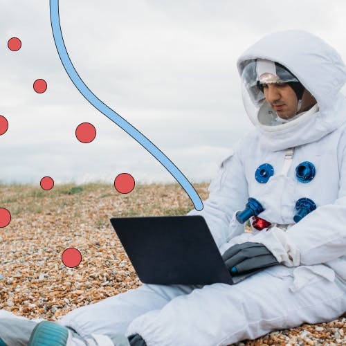 Man in astronaut suit with laptop