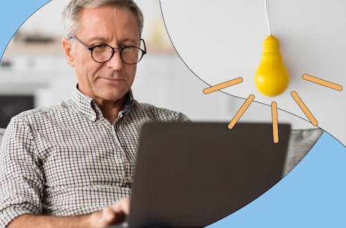 Image of middle aged worker on his laptop concentrating with colourful graphics