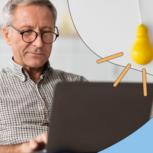 Image of middle aged worker on his laptop concentrating with colourful graphics