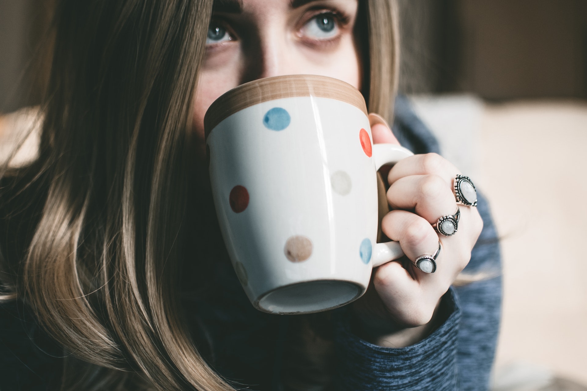 Woman sipping from a coffee mug