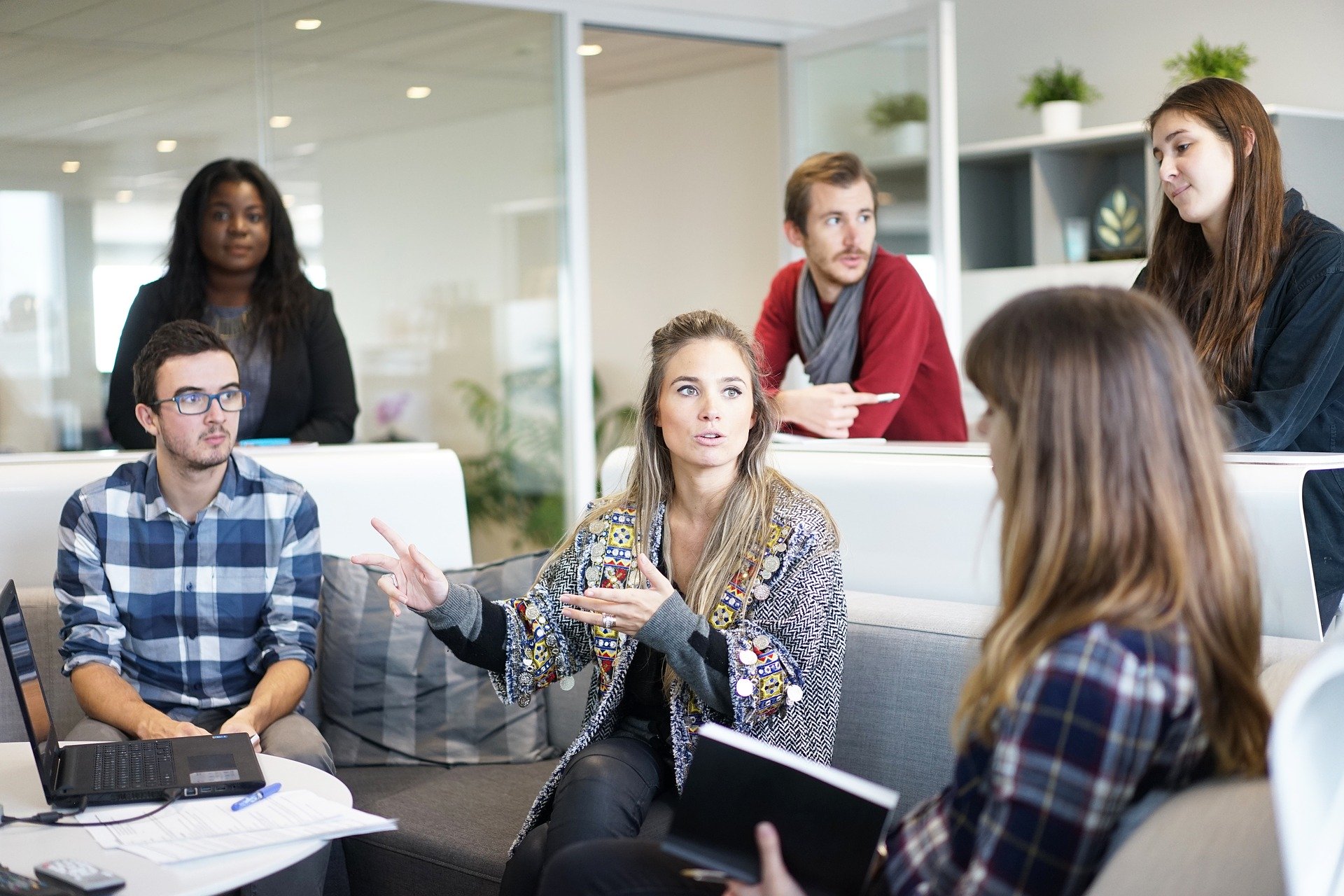 A group of colleauges talking in a work meeting