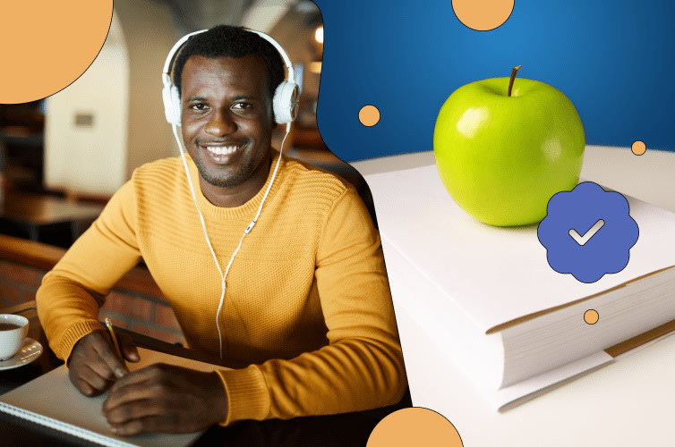 Man sitting at desk with headphones on smiling