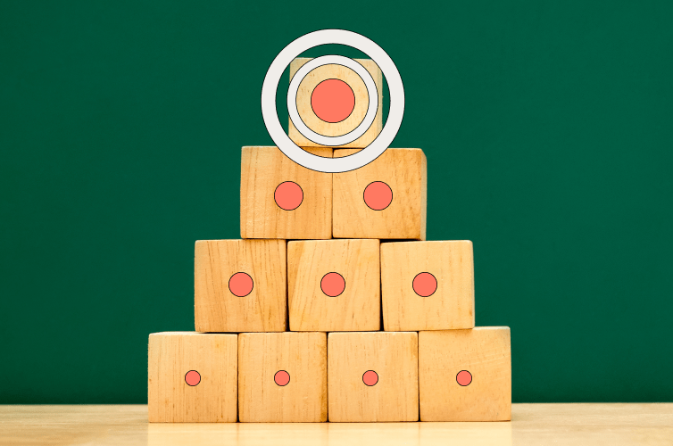 wooden blocks stacked on top of each other in a pyramid